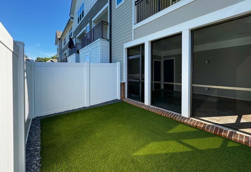 Townhomes at Bridlestone enclosed patio with couches. tables, and plants